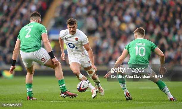 George Furbank of England chips past Dan Sheehan and Jack Crowley of Ireland during the Guinness Six Nations 2024 match between England and Ireland...