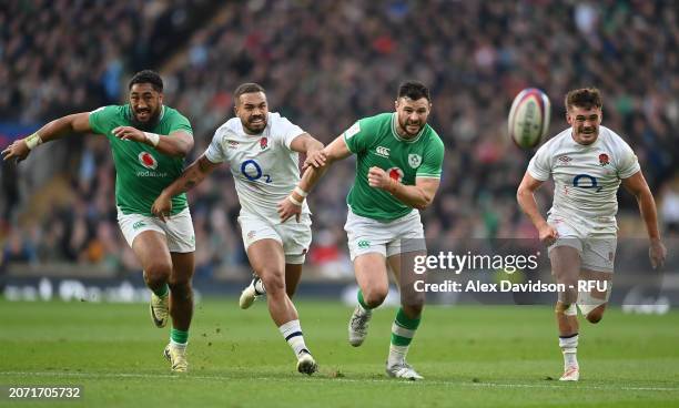 Bundee Aki and Robbie Henshaw battle with Ollie Lawrence and George Furbank of England during the Guinness Six Nations 2024 match between England and...