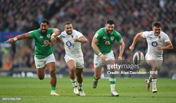 Bundee Aki and Robbie Henshaw battle with Ollie Lawrence and George Furbank of England during the Guinness Six Nations 2024 match between England and...