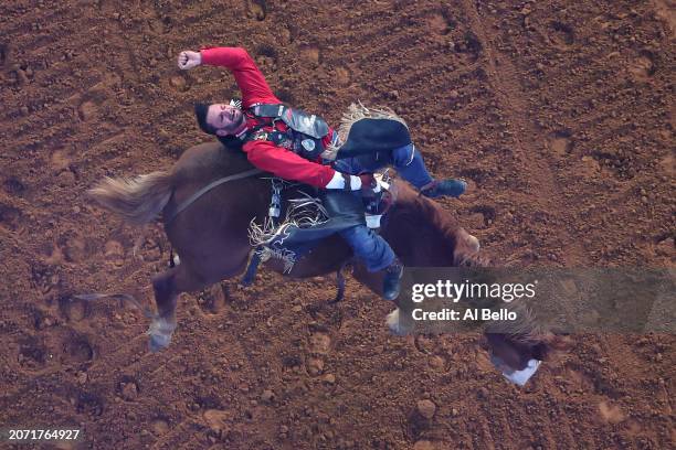 Taylor Broussard, riding Gander Goose, competes in the bareback riding event during The American Rodeo by Teton Ridge at Globe Life Field on March...