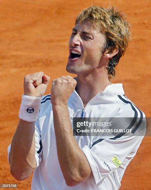 Spain's Juan Carlos Ferrero jubilates following his Roland Garros French Tennis Open final match against Netherlands' Martin Verkerk, 08 June 2003 in...