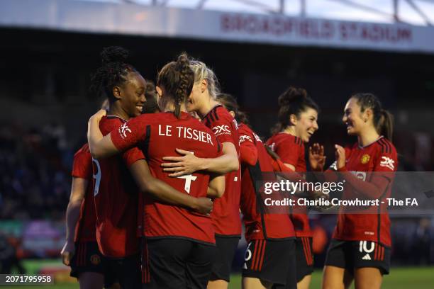 Manchester United players celebrate the teams third goal during the Adobe Women's FA Cup Quarter Final between Brighton & Hove Albion and Manchester...