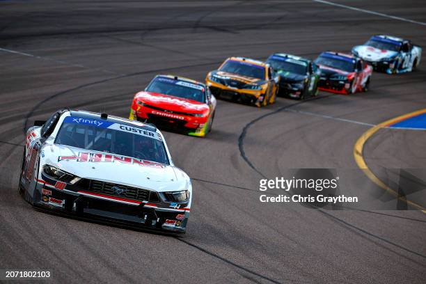 Cole Custer, driver of the Haas Automation Ford, leads the field during the NASCAR Xfinity Series Call 811.com Every Dig. Every Time. 200 at Phoenix...