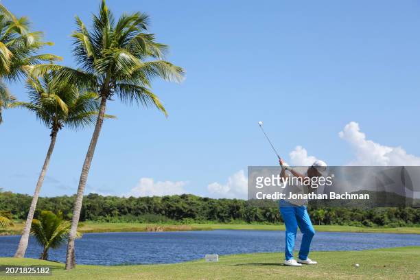 Scott Piercy of the United States plays his shot from the sixth tee during the third round of the Puerto Rico Open at Grand Reserve Golf Club on...