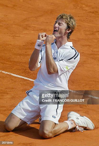 Spain's Juan Carlos Ferrero jubilates after he defeated his Dutch opponent Martin Verkerk, 08 June 2003 in Paris, following their Roland Garros...