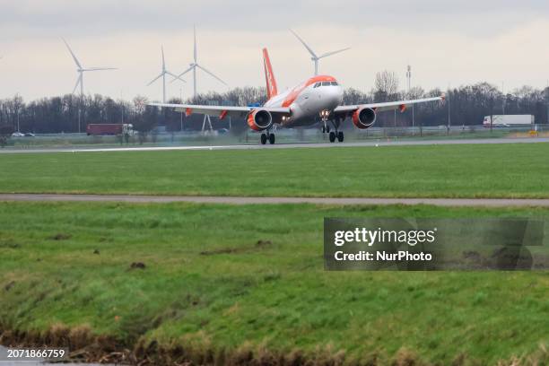 EasyJet Airbus A319 airplane seen landing and taxiing at Polderbaan runway of Amsterdam Schiphol Airport AMS. The A319 passenger aircraft of the...