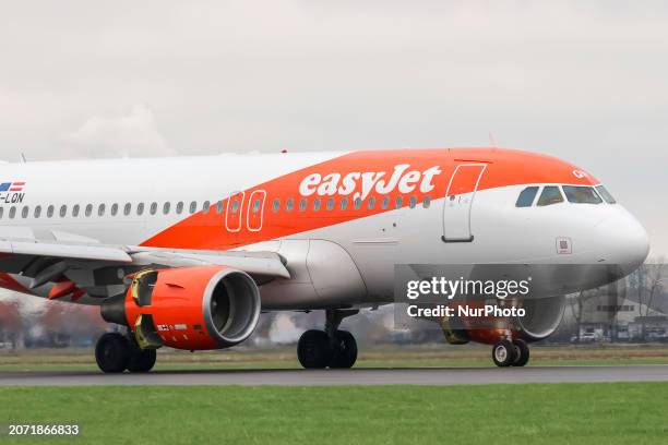 EasyJet Airbus A319 airplane seen landing and taxiing at Polderbaan runway of Amsterdam Schiphol Airport AMS. The A319 passenger aircraft of the...