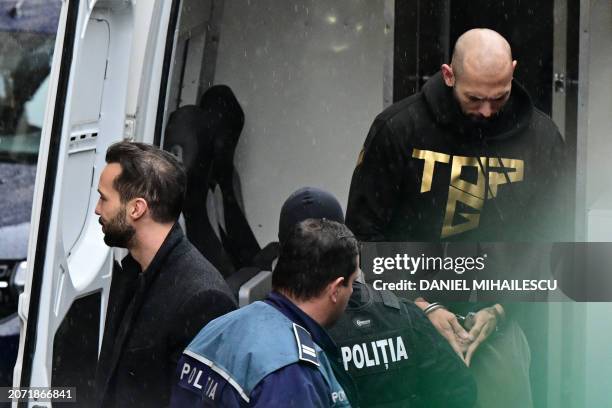 British-US former professional kickboxer and controversial influencer Andrew Tate and his brother Tristan Tate are accompanied by police officers...