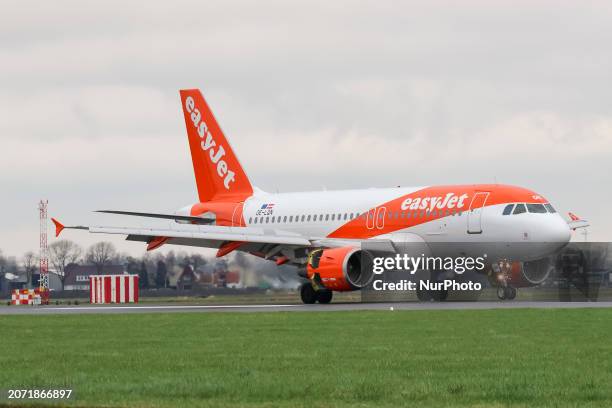 EasyJet Airbus A319 airplane seen landing and taxiing at Polderbaan runway of Amsterdam Schiphol Airport AMS. The A319 passenger aircraft of the...