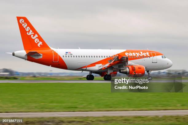 EasyJet Airbus A319 airplane seen landing and taxiing at Polderbaan runway of Amsterdam Schiphol Airport AMS. The A319 passenger aircraft of the...