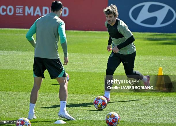 Atletico Madrid's French forward Antoine Griezmann attends a training session on the eve of their UEFA Champions League last 16 second leg football...