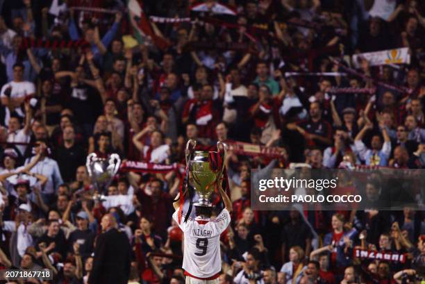 Milan AC forward Italian Filippo Inzaghi jubilates with the cup after winning the European Champions League Final match against Juventus, 28 May 2003...