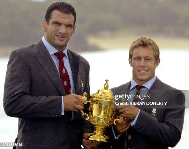 England's Martin Johnson and Jonny Wilkinson hold the Webb Ellis Trophy on the roof of the team hotel overlooking Manly beach in Sydney 23 November...