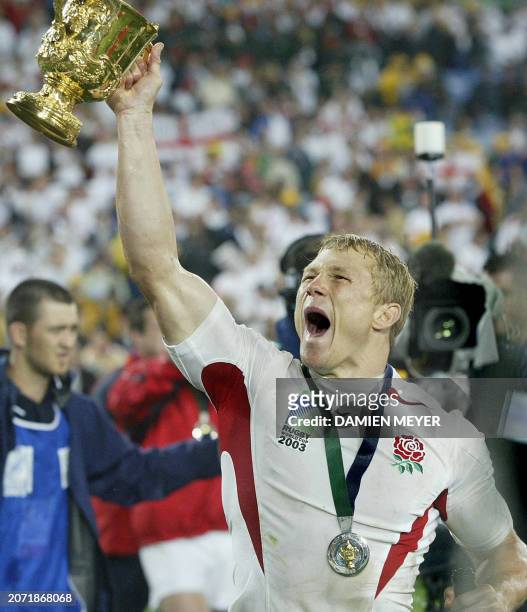 English fullback Josh Lewsey lifts the William Webb Ellis Cup after winning the Rugby World Cup final between Australia and England, 22 November 2003...