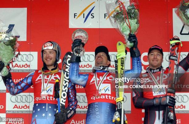 Swiss Michael von Grueningen with the overall Giant Slalom World Cup trophy, after the last race of the season in Hafjell, 15 March 2003, poses on...