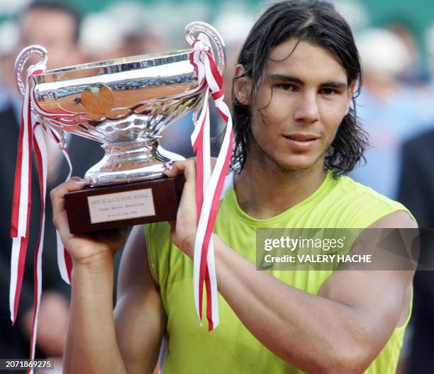 Spain's Rafael Nadal holds his trophy after winning against Switzerland's Roger Federer during their Monte-Carlo ATP masters series tournament final...