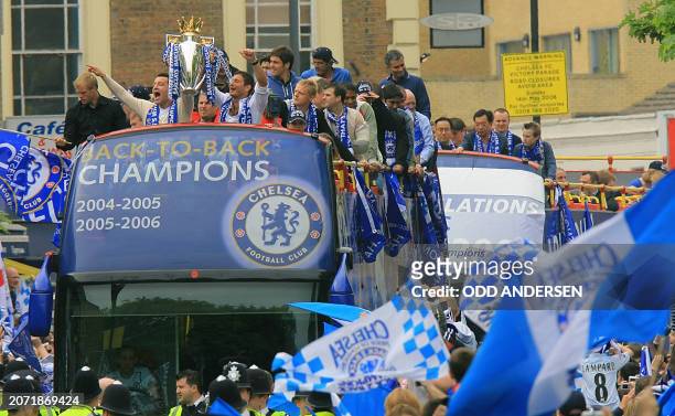 Chelsea captain John Terry and midfielder Frank Lampard hold the Premiership trophy aloft on an open-top bus during a parade in west London, 14 May...