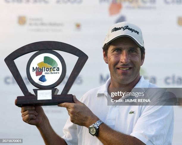 Spain's Jose Maria Olazabal holds up his trophy after winning the Mallorca Classic Golf at the Pula Golf in Mallorca Island 23 October 2005. AFP...