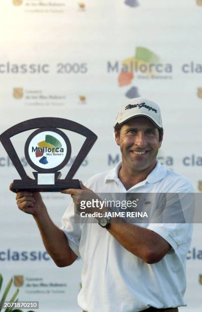 Spain's Jose Maria Olazabal holds up his trophy after winning the Mallorca Classic Golf at the Pula Golf in Mallorca Island 23 October 2005. AFP...