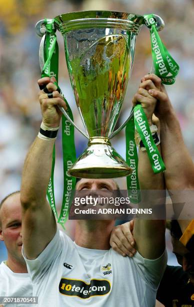 London Wasps captain Lawrence Dallaglio looks up at the Heineken Cup after the Wasps defeated Toulouse 23 May, 2004 in Twikenham, west London. The...