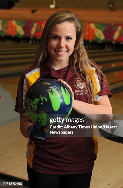 Bishop Gibbons bowler Janielle Irwin poses with her bowling ball at Sportsmans Bowl on Thursday, Jan. 23, 2014 in Schenectady, N.Y.