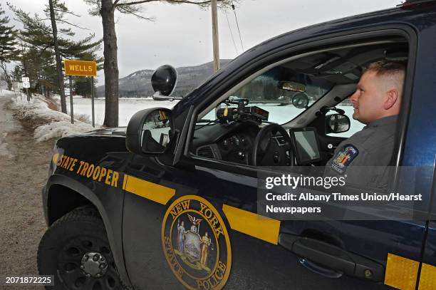 State Trooper Ronald Dacre is seen pulled over on the side of the road as he patrols his jurisdiction on Wednesday, March 19, 2014 in Wells, N.Y....