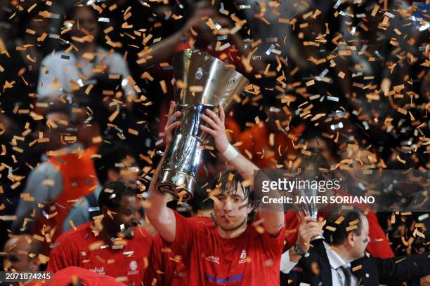 Moscow's Matjaz Smodis holds the trophy after winning during the Euroleague Final Four basketball final game against Maccabi Tel Aviv on May 04, 2008...