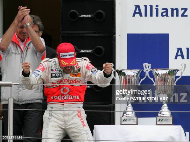 Spanish McLaren-Mercedes driver Fernando Alonso celebrates at the Nuerburgring racetrack, 22 July 2007 in Nuerburgring, after the European Formula...