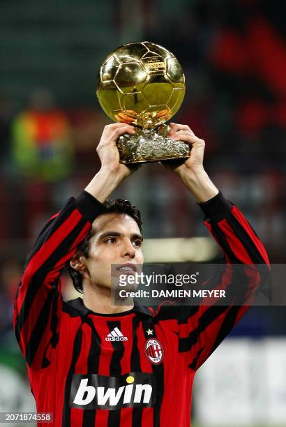 Milan's Brazilian midfielder Kaka hold his Bollon d'Or trophy before the UEFA Champions League Group D qualification match between AC Milan and...