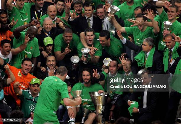 Panathinaikos Athens players and officials celebrate their victory over CSKA Moscow during their Euroleague basketball Final Four final match at the...