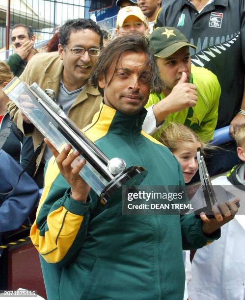 Pakistan's Shoaib Akhtar amongst the fans with the series trophy and his Man of the Match trophy after his team win against the New Zealand Black...