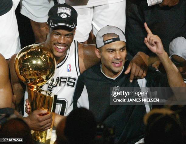 David Robinson of the San Antonio Spurs and Frenchman Tony Parker celebrate after beating the New Jersey Nets in game six of the NBA Finals at SBC...