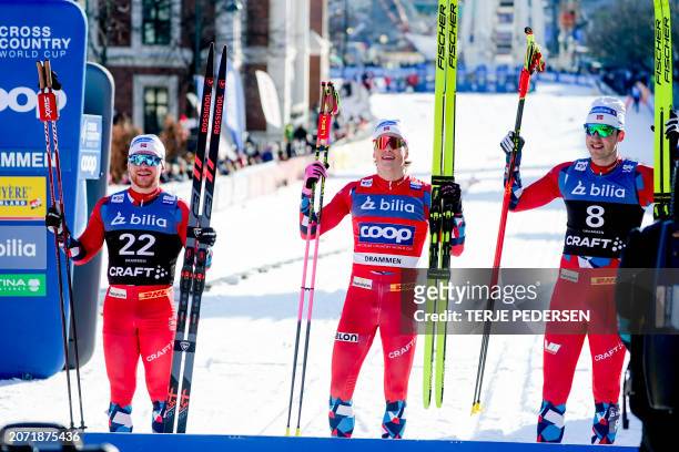 Second placed Norway's Haavard Solaas Taugbol, winner Norway's Johannes Hosflot Klaebo and third placed Norway's Even Northug pose after the Men's...
