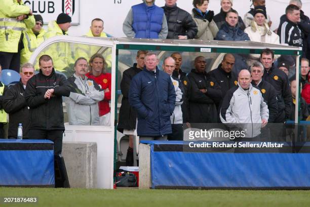 February 28: Sir Alex Ferguson, Manager of Manchester United, Physio Rob Swire of Manchester United and Mike Phelan Assistant Manager on team bench...