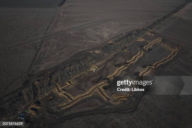 Drone view of the construction of the defense line on March 12, 2024 in Kharkiv region, Ukraine. Ukraine has accelerated the building of...