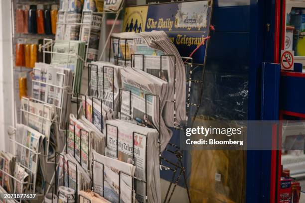 Copies of The Daily Telegraph newspaper and other national newspaper titles for sale on a newsstand in London, UK, on Tuesday, March 12, 2024. Rupert...