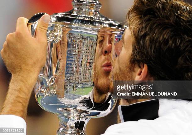 Tennis player Juan Martin Del Potro from Argentina kisses his trophy after beating Roger Federer from Switzerland during the final of the 2009 US...