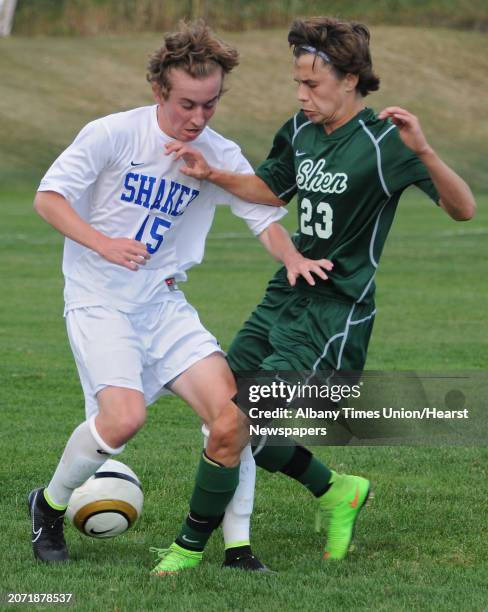 Shaker's Carter Haydock battles for the ball with Shenendehowa's Adel Cekic during a soccer game on Tuesday, Sept. 23, 2014 in Latham, N.Y.