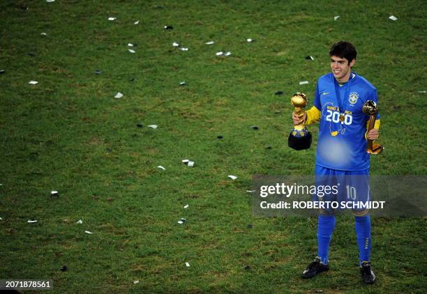 Brazilian midfielder Kaka poses with the trophy and his "golden ball" award of the tournament after the Fifa Confederations Cup final football match...