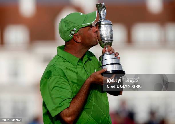 Golfer Stewart Cink kisses the Claret Jug after winning the play-offs against US golfer Tom Watson, on the 18th green, on the final day of the 138th...