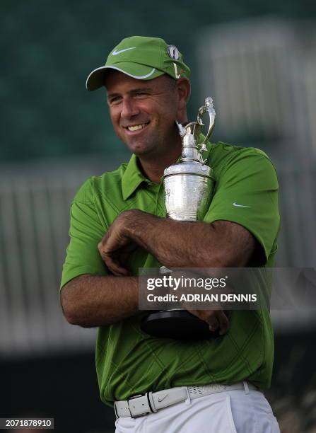 Golfer Stewart Cink hugs the Claret Jug after winning the 138th British Open Championship at Turnberry Golf Course in south west Scotland, on July...