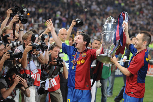 Barcelona´s Argentinian forward Lionel Messi and Barcelona´s midfielder Andres Iniesta celebrate with the Champions League Cup afte the trophy...