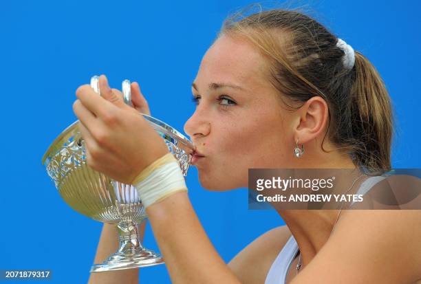 Magdalena Rybarikova of Slovakia kisses the Maud Watson trophy after winning the WTA AEGON classic tennis tournament final against China's Li Na at...