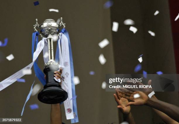 Porto's players celebrate with the trophy after winning the Portugal's Cup final football match against Pacos Ferreira, on May 31, 2009 at the Jamor...