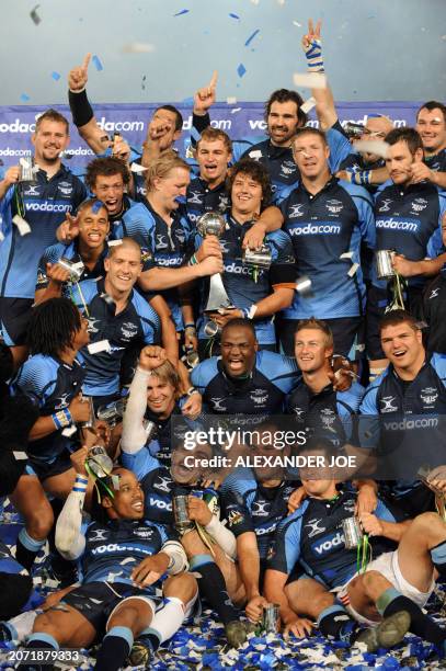 Victor Matfield and his team South Africa's Vodacom Bulls celebrate the victory at the final of the Super 14 match between South African Bulls and...