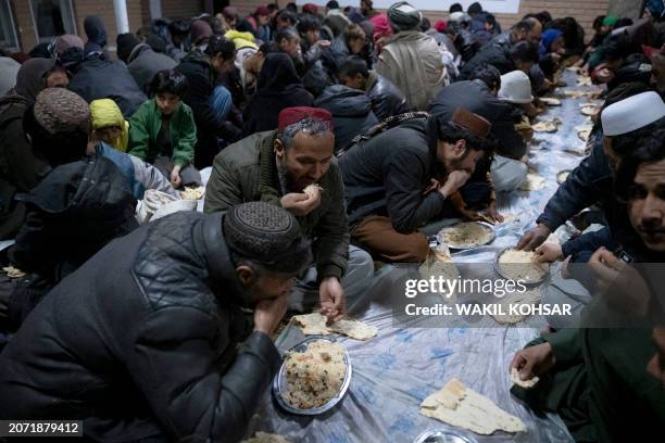 Afghan Muslims break their fast during the Islamic holy month of Ramadan at the Wazir Akbar Khan mosque in Kabul on March 12, 2024.