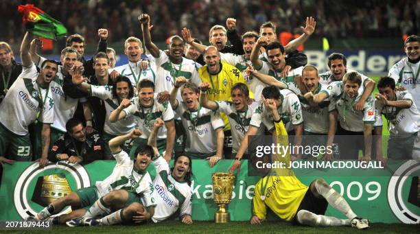 Werder Bremen's celebrate with the trophy after the men's DFB German Cup final football match Werder Bremen vs Bayer Leverkusen on May 30, 2009 at...