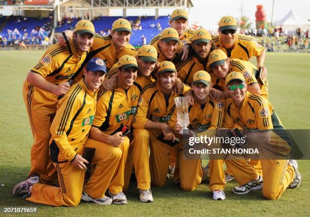 Australian cricket team pose with series trophy on July 6, 2008 at Warner Park in Basseterre as they swept West Indies 5-0 in their One-Day...
