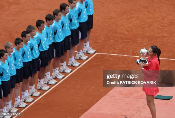 Serbian player Ana Ivanovic kisses her trophy after winning against Russian player Dinara Safina during their French tennis Open final match at...