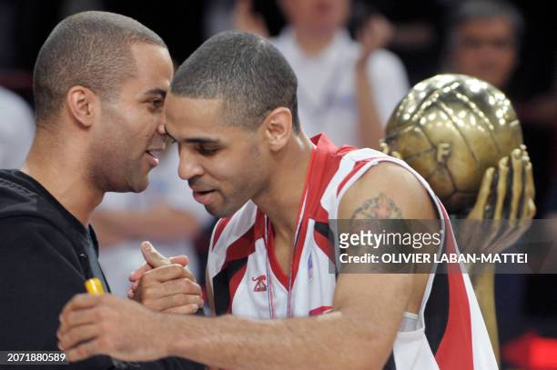 Nancy's Jeff Greer is congratulated by French Tony Parker after being awarded best baketball player of the French championship at the end of the...